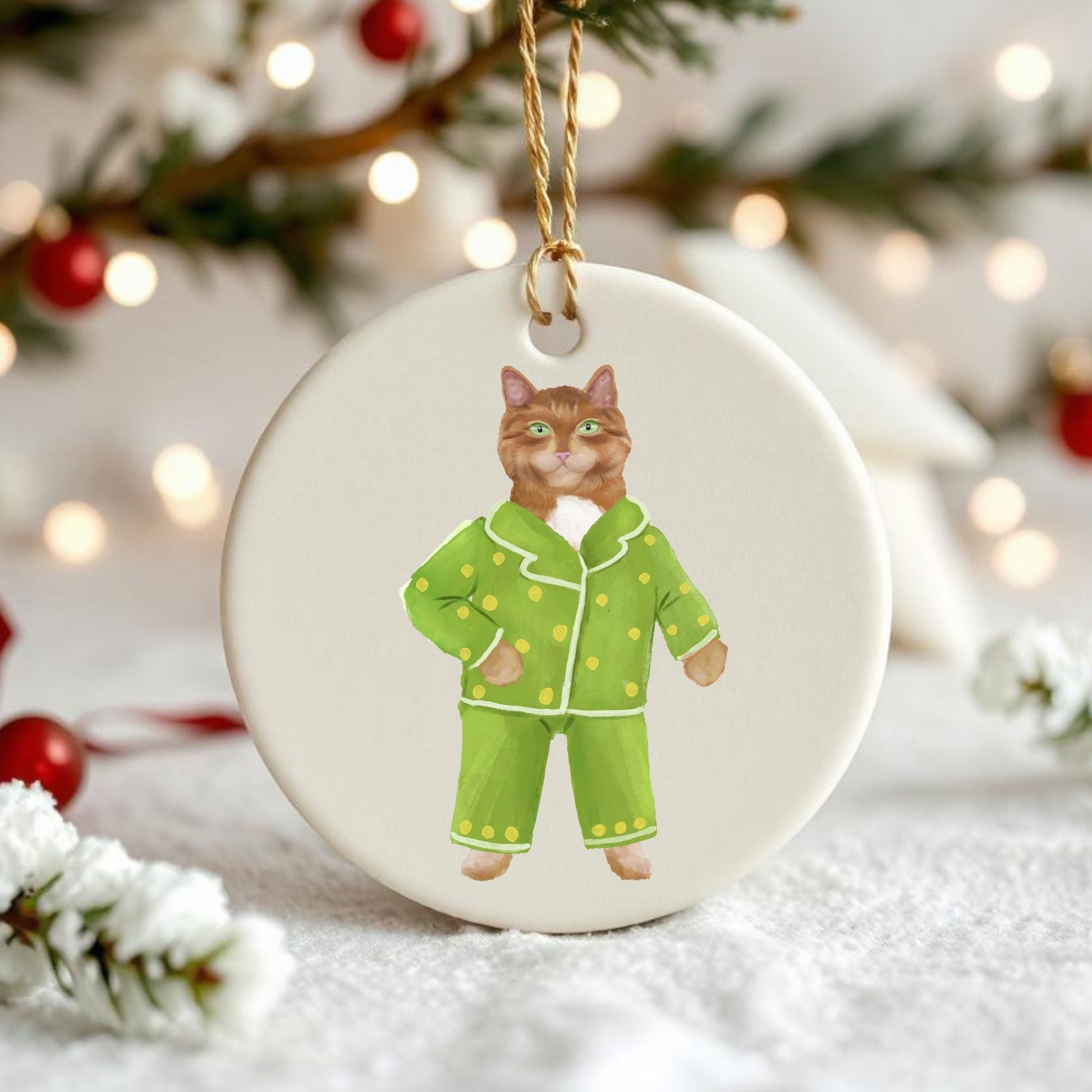 Ginger Cat in Green Pajamas Ceramic Ornament - MerikaArt