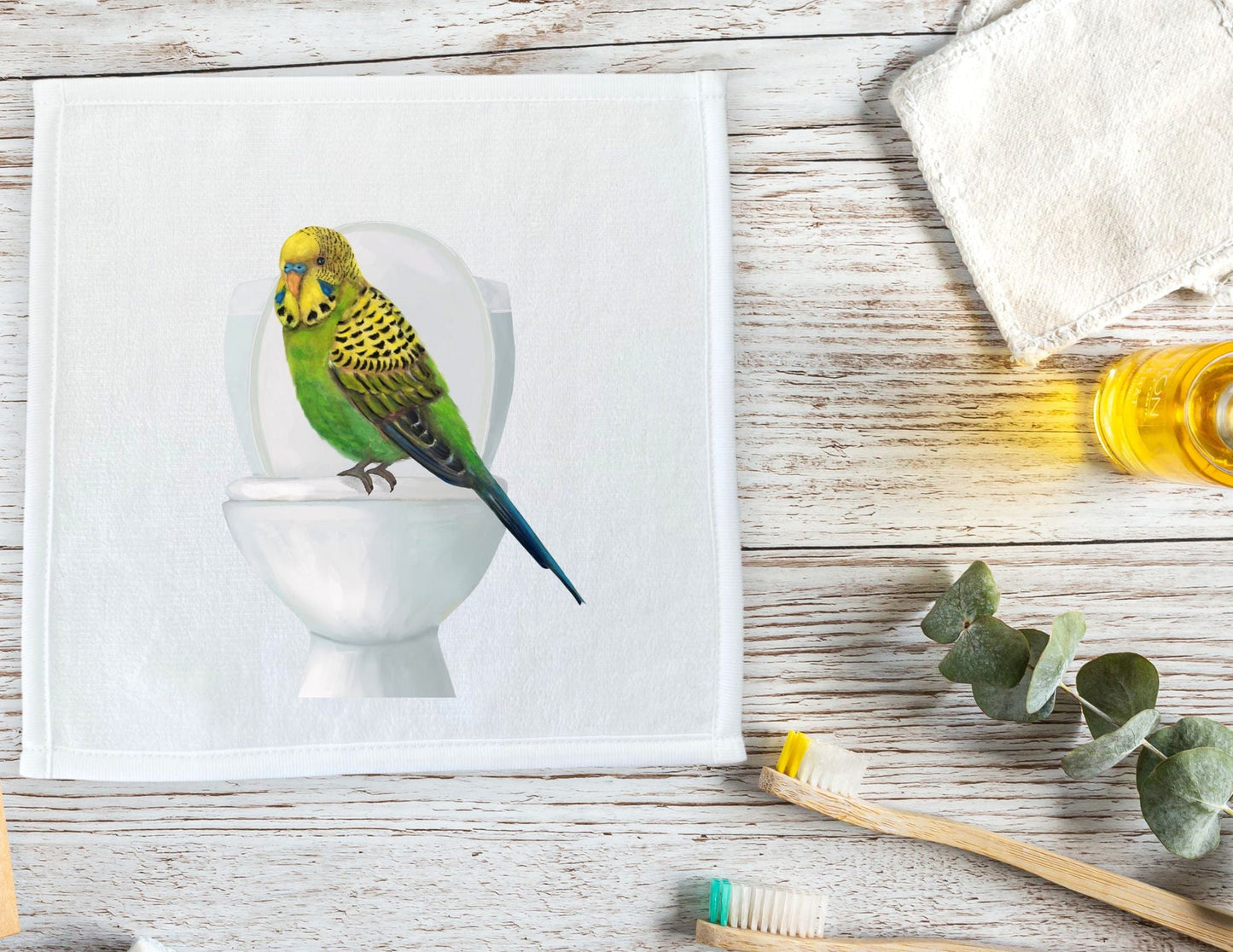 Playful Budgie on Toilet Washcloth – A Quirky Bird Lover's Gift - MerikaArt