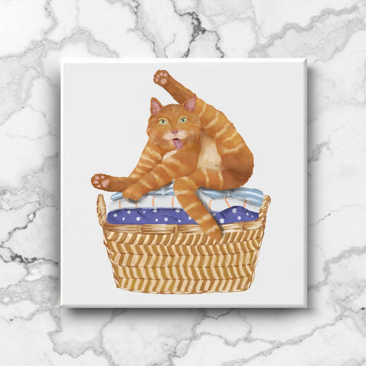 Playful Cat in Laundry Basket Ceramic Tile - MerikaArt